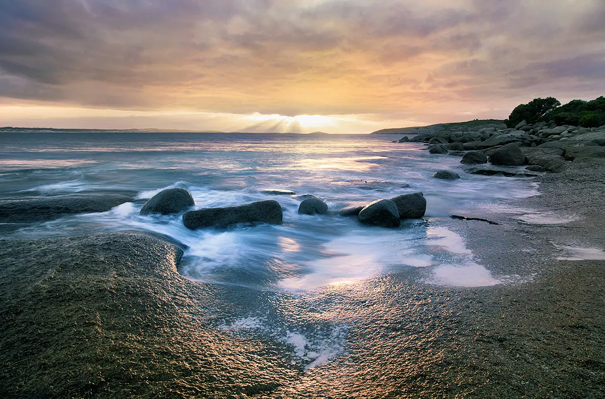 Early morning sun beams poking through at Alexander Bay, WA